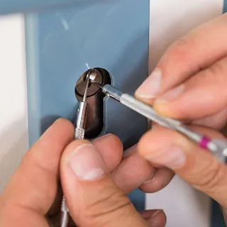 A locksmith helping a client regain entry.